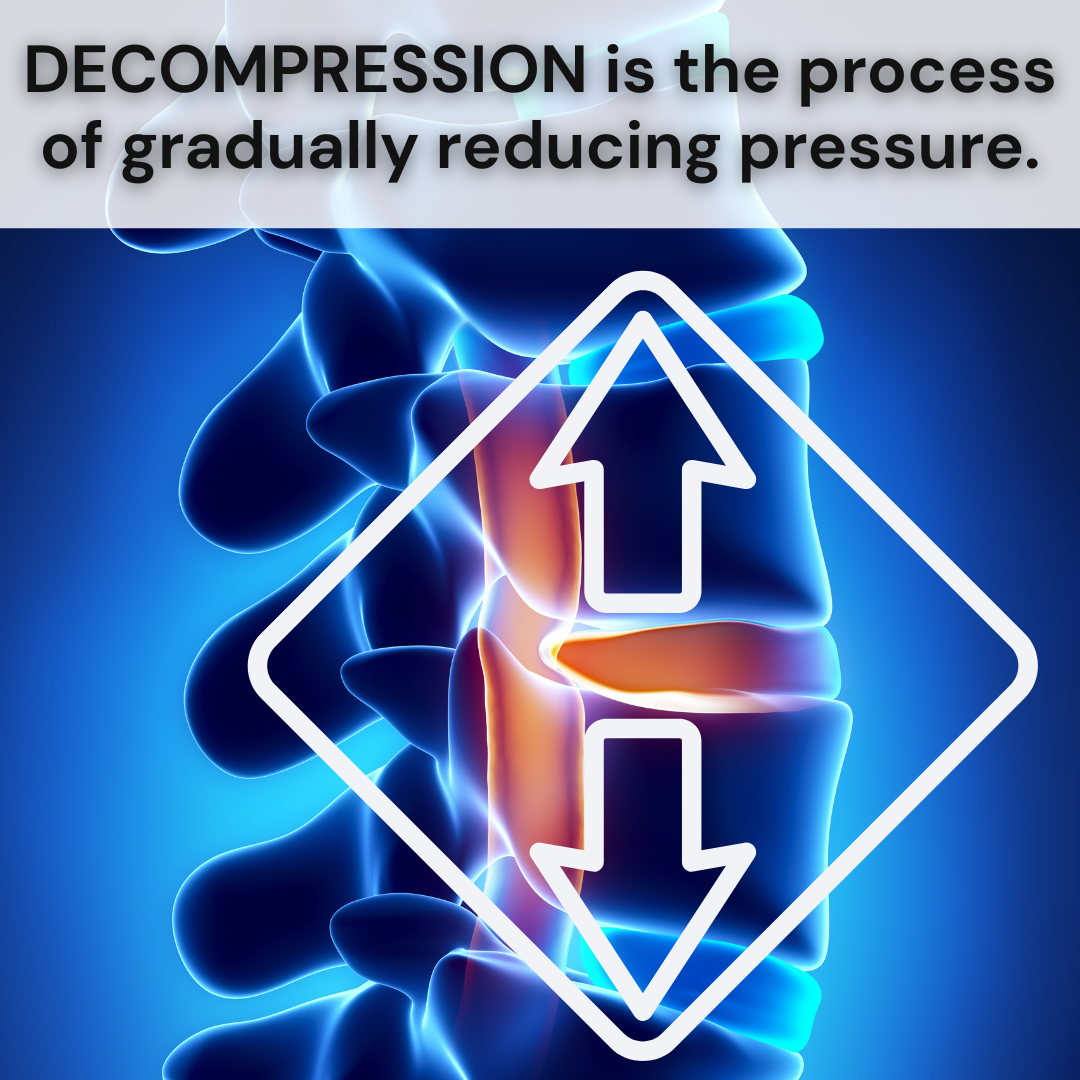 doctor holding spine model showing decompression of the spine