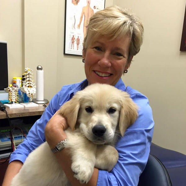 Dr. Vivian Ebert holding a puppy